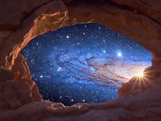 A galaxy seems to rise like a sun through a natural sandstone arch in this digital composite. The galaxy is M31, the Great Galaxy in Andromeda. The image of the Andromeda Galaxy was taken using a Cassegrain 14.5" at f/8. --- Image by © Tony Hallas/Science Faction/Corbis